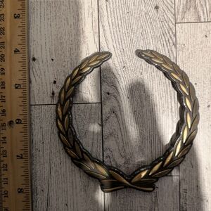 Cadillac Elegant Gold Wreath Emblem